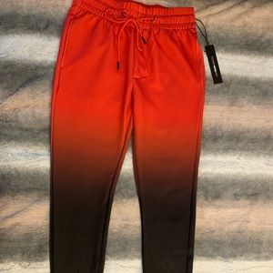 Red and black faded into pants size medium new with tags